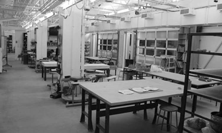 Worktables and throwing wheels in the throwing/handbuilding room